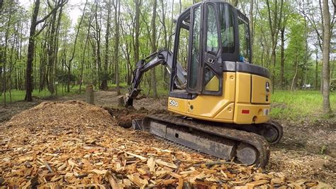 best mini excavator for digging stumps|stump size for excavators.